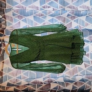 Green and white spotted long sleeve thigh length dress.